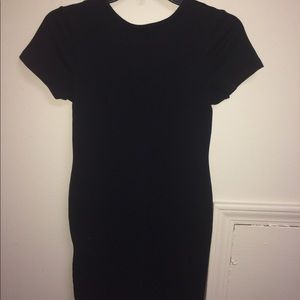 Black tight fitted dress.